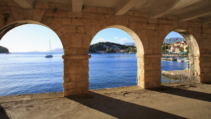 Fototapeta premium View of Cavtat shoreline through arches
