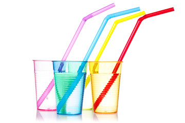 Four colorful drinks with straws