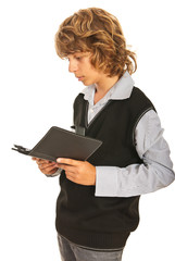 Teen boy reading tablet pc