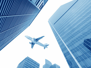 Fototapeta na wymiar the airplane with the city