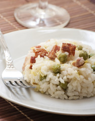 lemon risotto with bacon and peas close up