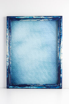 Blue grunge wooden picture frame