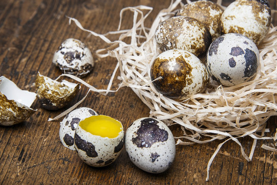 fresh quail eggs on a wooden table