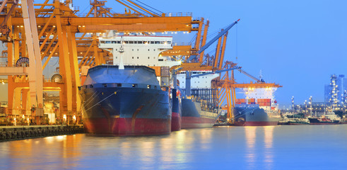 panorama scene of ship yard with heavy crane in beautiful twilig