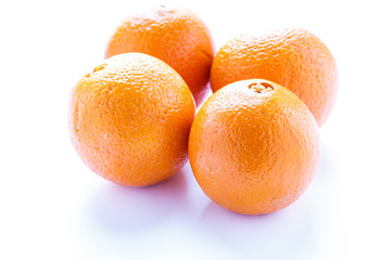 Four Naval Oranges on White