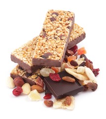 Close-up of cereal bars with dry fruits, nuts and chocolate.