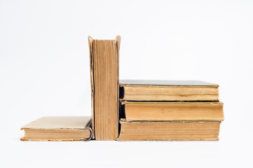Stack of old books on a white background