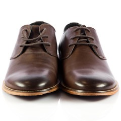 Brown man's shoes isolated on white background.  Pair of brown m