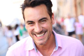 Closeup of handsome guy wearing pink shirt