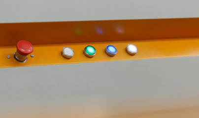 Image of glowing buttons on working loom