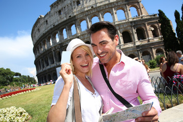 Fototapeta premium Tourists holding visitor's museum pass in Rome