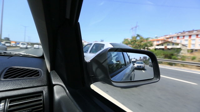 time lapse freeway driving with rear view mirror