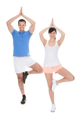 Obraz na płótnie Canvas Portrait Of Couple Doing Yoga