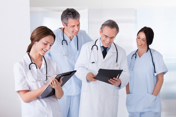 Portrait Of Happy Doctors Working Together