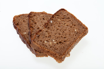 Slices of dark bread isolated over white
