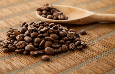 Handful coffee beans and coffee beans