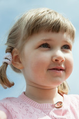 Portrait of a pretty little girl with pigtails