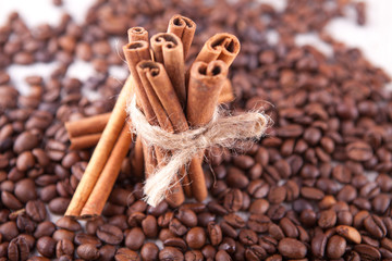 cinnamon sticks with scattered coffee beans