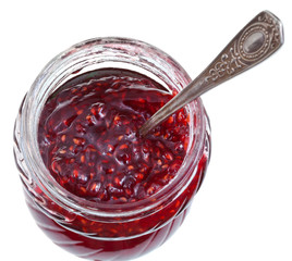 spoon in jar of raspberry jam