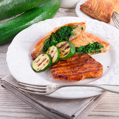 grilled steaks with puff pastry bag and zucchini