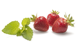 Strawberries one white with green leaf