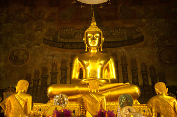 Gold Buddha statue and wall paintings in Grand Hall, Thailand