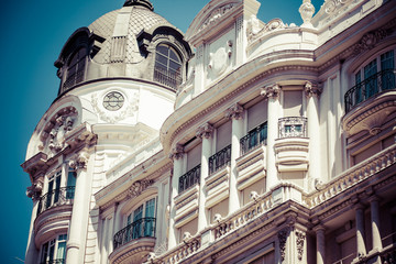 Fototapeta premium Old ornamental building at Gran Via in Madrid, Spain