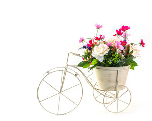 Bouquet of flowers in steel bucket on mini tricycle model