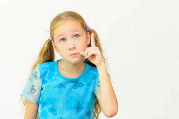 Cheerful smiling little girl at the white background