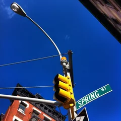 Zelfklevend Fotobehang traffic light on spring street © Morgan