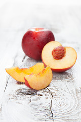 Fresh and tasty peaches on a table