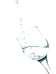 Water splashing in a glass , vertical