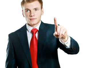 A young man pointing something isolated on white background