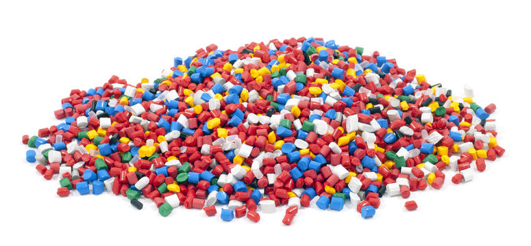 colorful plastic polymer granules on white background