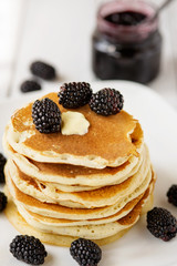 Pancakes with blackberry and maple syrup