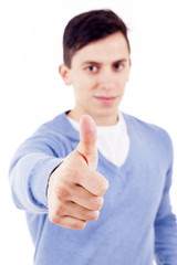 Happy man giving thumbs up sign, focus on the hand
