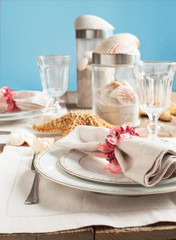 Summer table setting decorated with starfish and sea shell