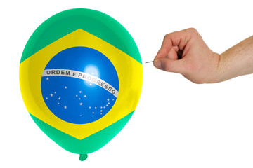 Bursting balloon colored in  national flag of brazil