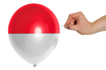 Bursting balloon colored in  national flag of indonesia