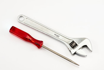 Spanner and a screwdriver on the white background