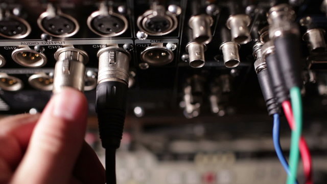 Inserting professional XLR audio cables to the pro recorder.