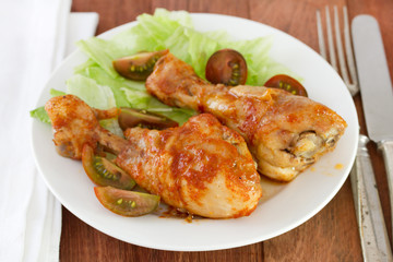 fried chicken with salad on white plate