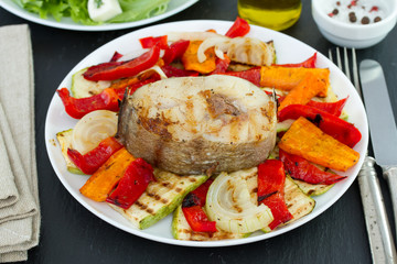 fried fish with vegetables on plate