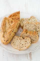 Fototapeta premium bread with cereals on white plate