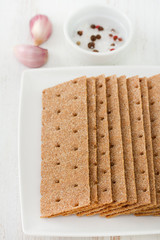 toasts on plate and bowl with salt