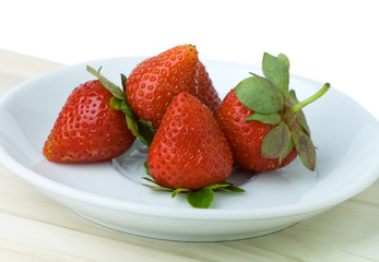 Strawberries on a white dish