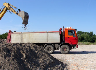 excavator and tipper truck dig - 53924547