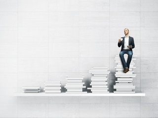 bookshelf and man with cup of coffee