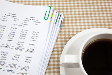Business report and cup of coffee