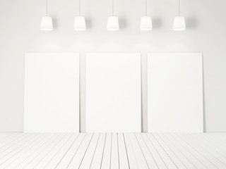 three blank posters and white wall
